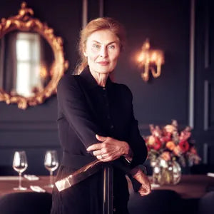 Hotel manager recommending the DROPSAVER® wine pourer for professional service and lasting quality.